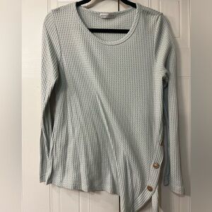 Medium top with asymmetrical hemline